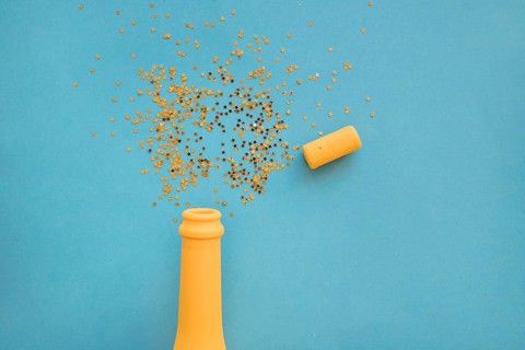 Spangles scattered from bottle table