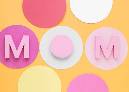 Top view mom word orange background