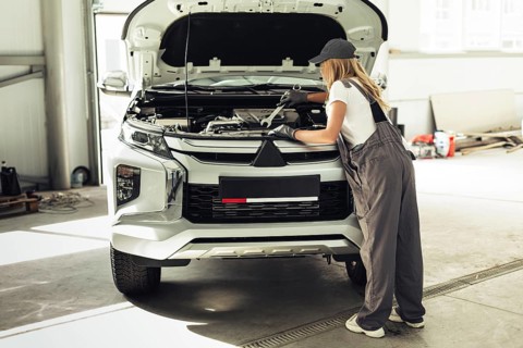 Front view mechanic woman working