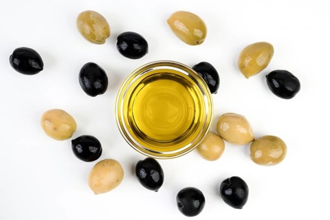 Top view organic olives with olive oil