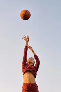 Young woman playing basketball