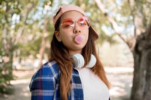 Girl making bubble gum