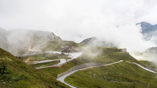 Morning fog drifts over a mountain ridge
