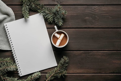 Top view hot chocolate with blank notebook copy space