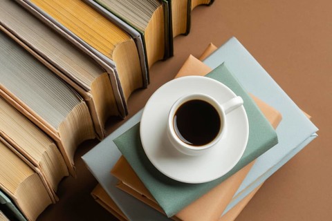 Books arrangement with cup cofee