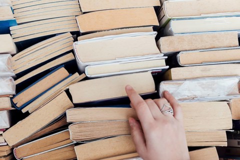 Person choosing books bookstore