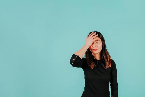 Facepalming asian woman