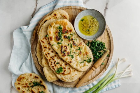 Pakistani food wooden board flat lay