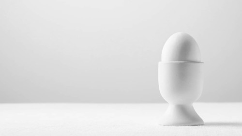 Front view white egg stand with copy space