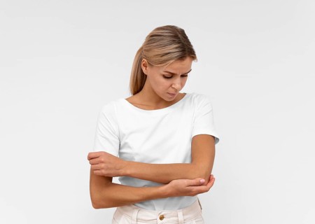 Front view woman with elbow pain