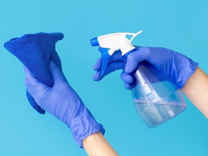 Hands with surgical gloves holding cloth ablution