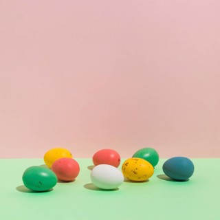Small colorful easter eggs scattered table