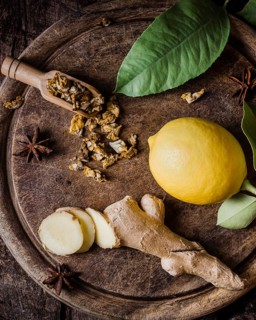 Top view lemon ginger slices cutting board