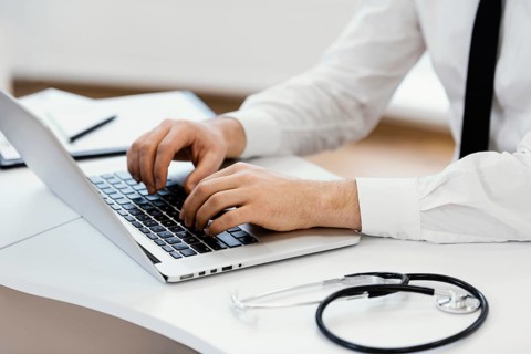 Close up hands typing keyboard