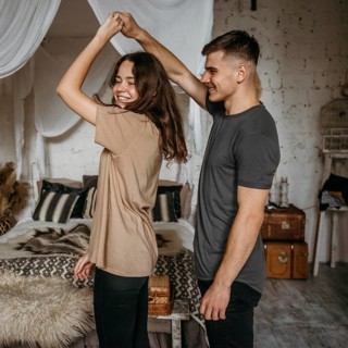 Adorable young couple dancing together