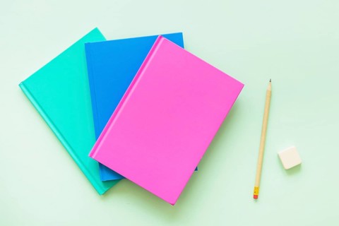 Colorful books with pen eraser