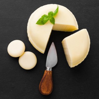 Flat lay cheese with knife