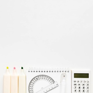 Top view back school essentials with calculator notebook