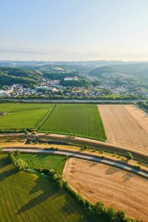 Aerial view over the fields and forests to the castle in Woerth an der Donau