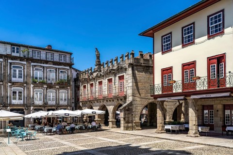 Restaurants at the Praca de Sao Tiago square and the former town hall in the old town of Guimaraes