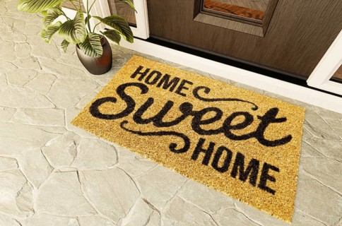 Home sweet home doormat on the porch at the front door