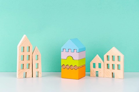 Miniature houses blue background