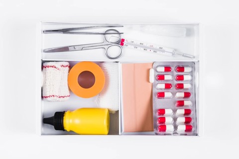 Open first aid kit white background