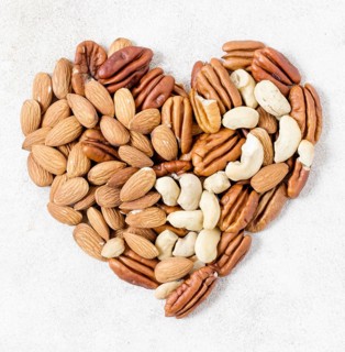 Top view heart made walnuts almonds