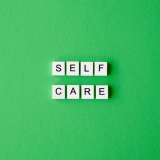 Flat lay letter cubes green background