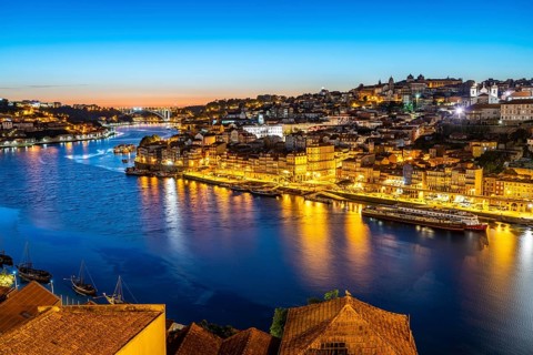 View over the river Douro to the old town of Porto at dusk