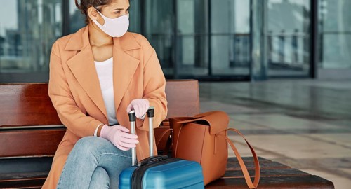 Woman with gloves medical mask airport during pandemic