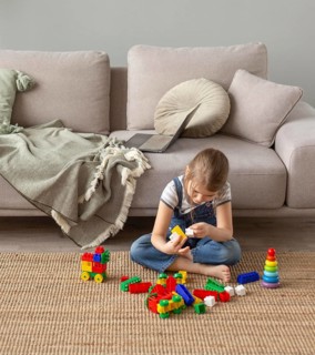 Full shot kid playing floor