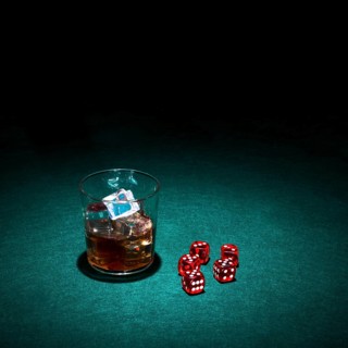 Glass whiskey red dice green casino table