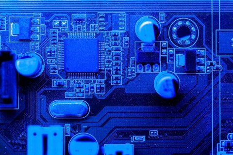 Blue themed circuit board with chip