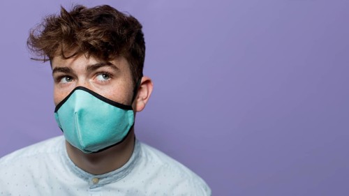 Portrait young man wearing mask