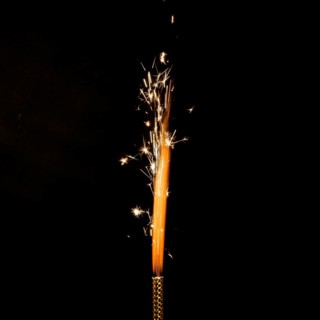 Flame with sparkles black background
