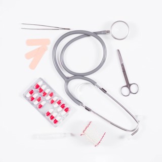 Pill blister pack with stethoscope medical equipments white background