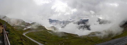 Morning fog drifts over a mountain ridge