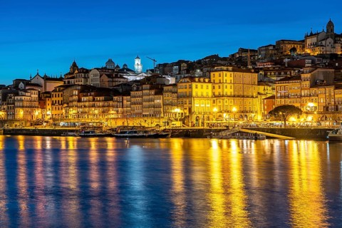 View over the river Douro to the old town of Porto at dusk