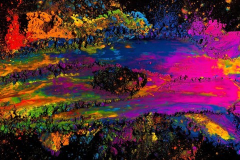 Abstract multicolored holi powder explosion black background