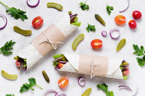 Arabic kebab sandwich wrapped thin pita top view