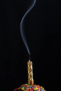 Smoke rising out blown candle