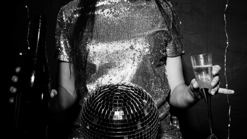 Lady with disco ball bottle glass