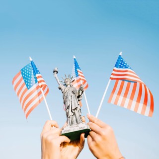 Hands waving american flags