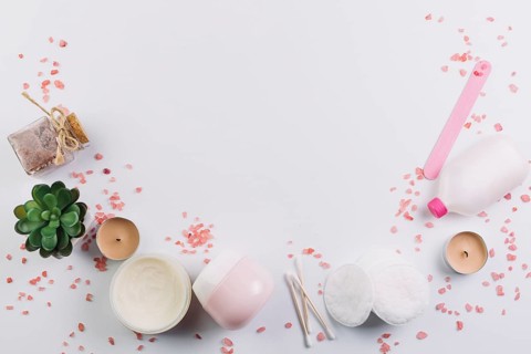 Plant candles near cosmetics