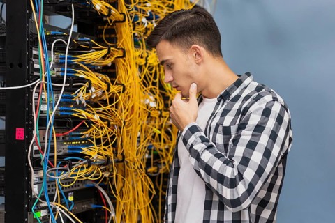 Young network engineer server room medium shot