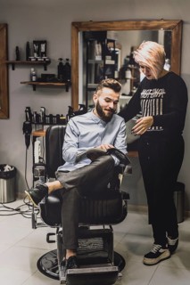 Customer showing magazine barber