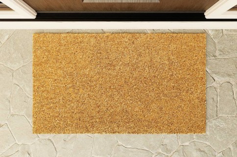 Overhead of blank doormat on the porch at the front door