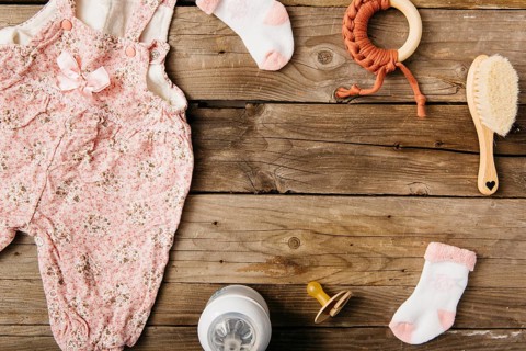 Baby s dress brush pacifier toy socks milk bottle wooden table
