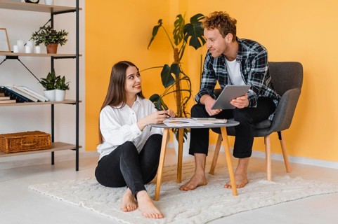 Couple making plans together redecorate house